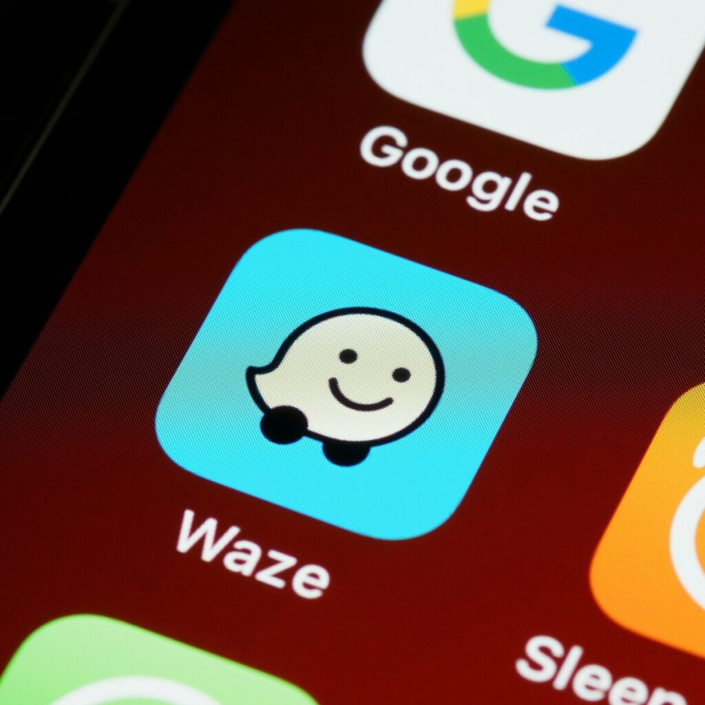 Waze Adds Gemini AI Features and Personalized Navigation black smartphone showing icons with icons